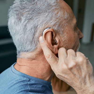 Older man wearing a hearing device
